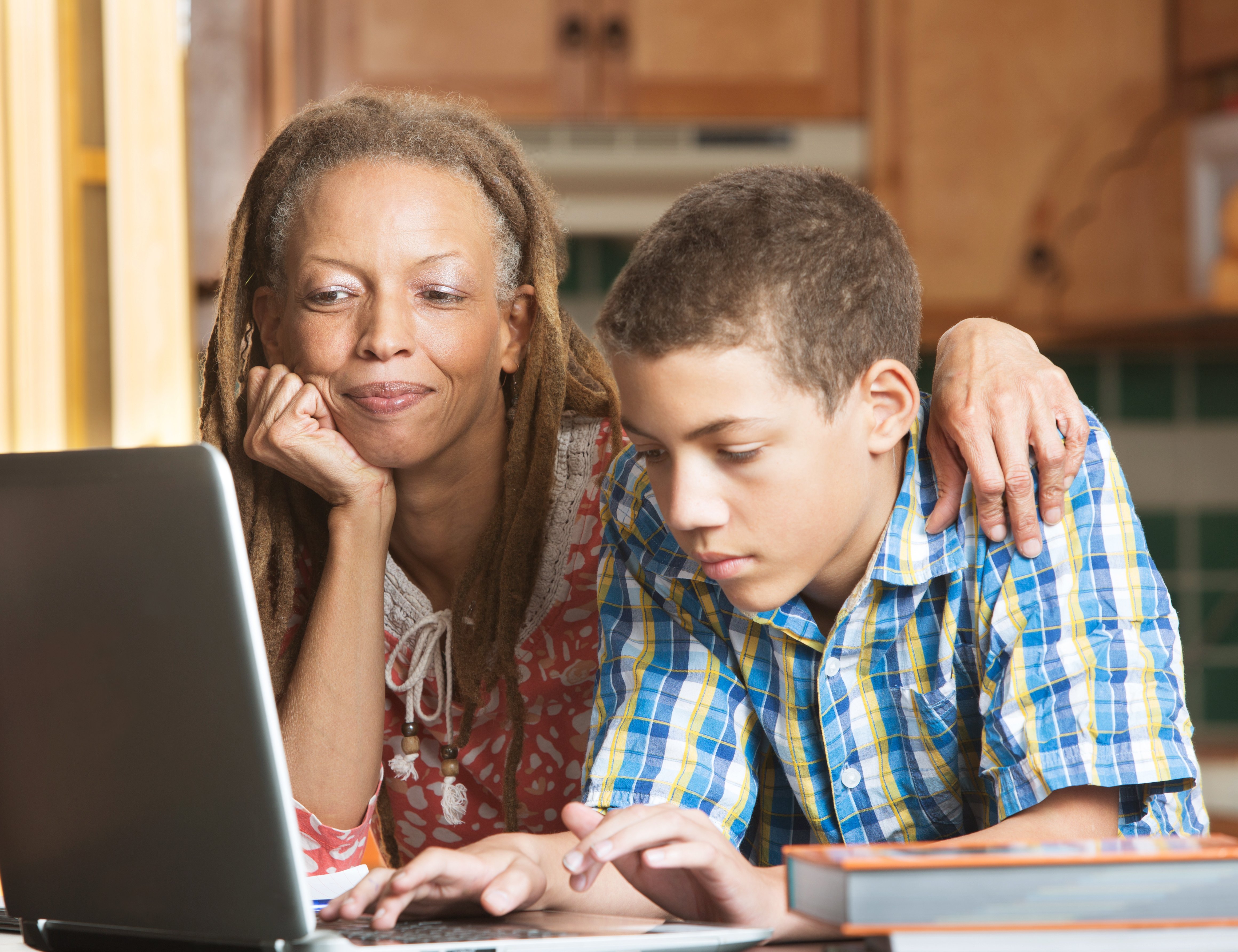 mom and son on computer