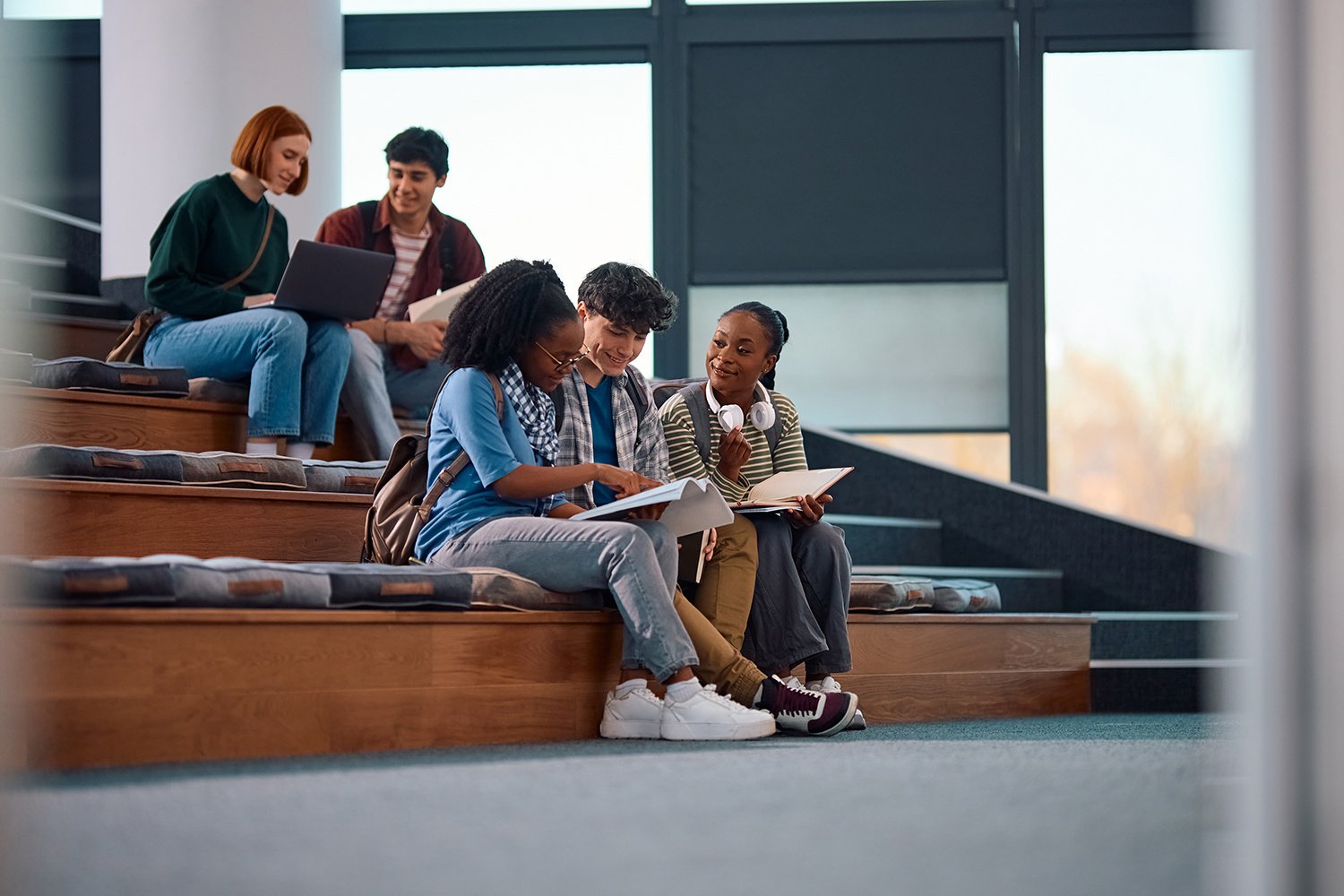 students chatting on steps